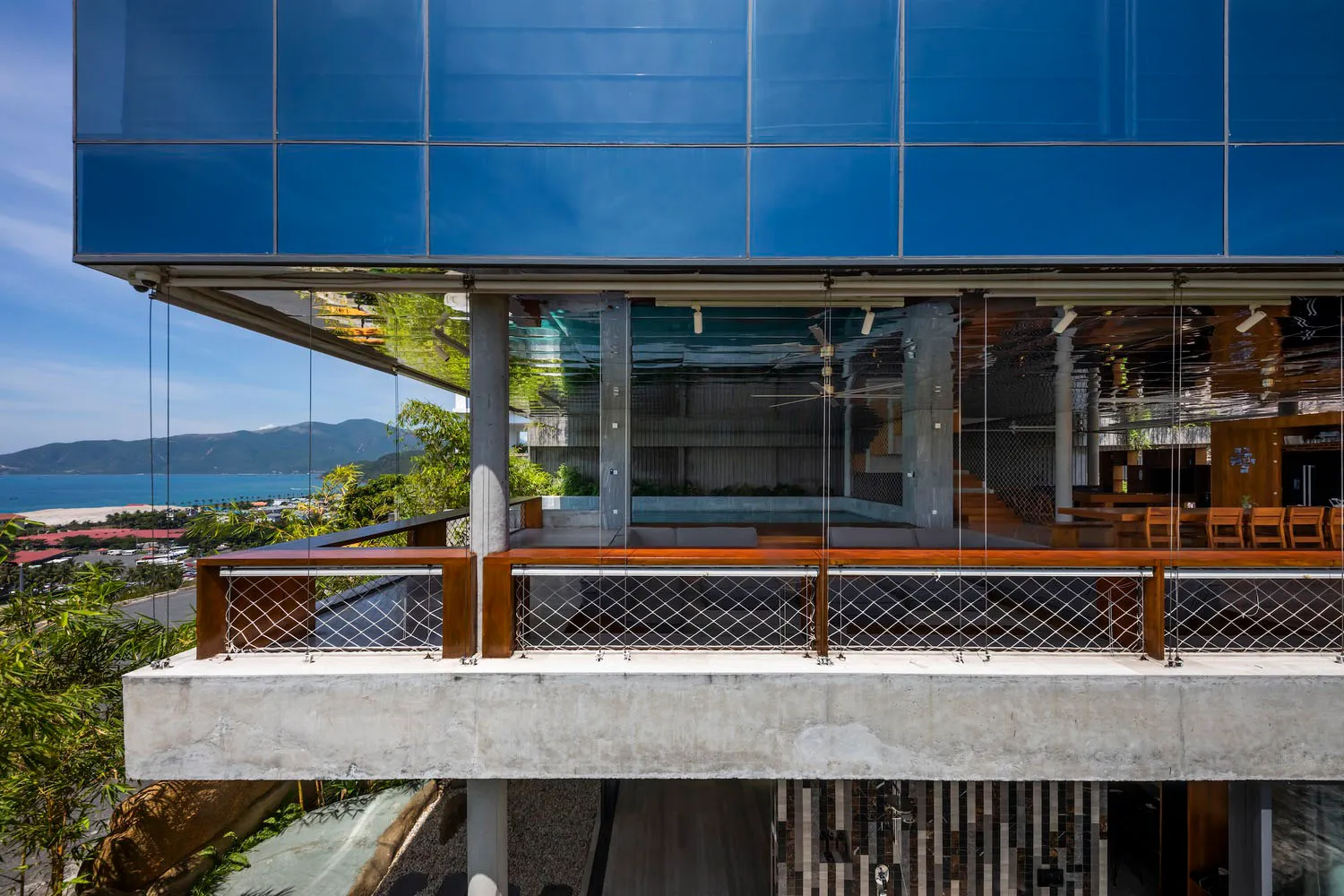 A modern building featuring extensive glass and concrete materials.
