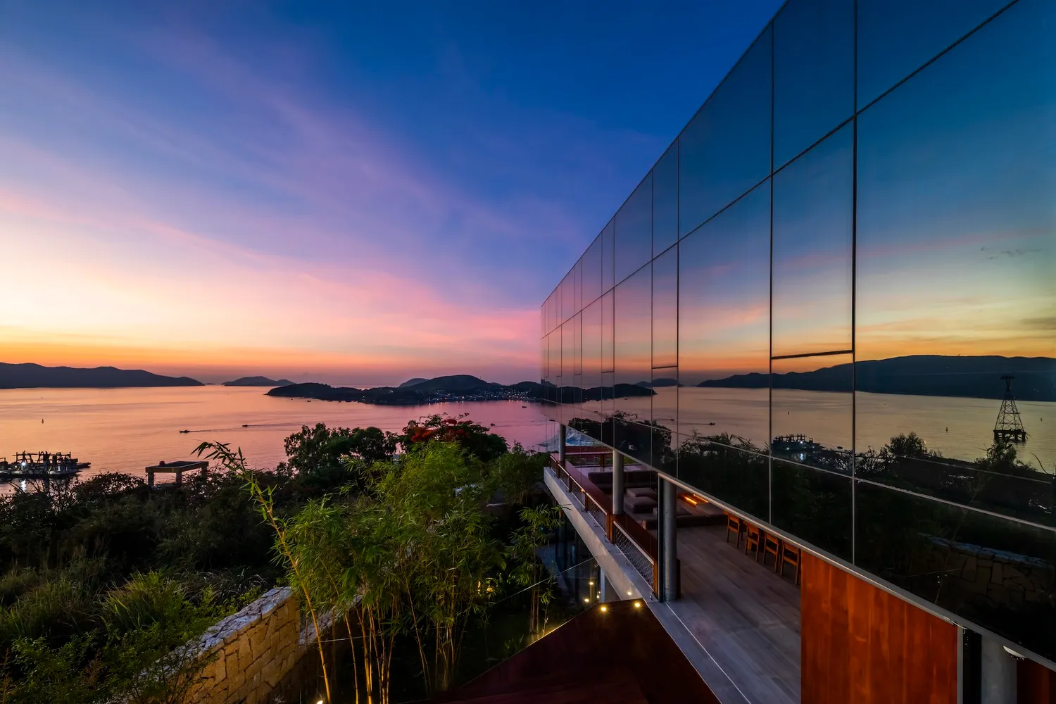 Modern residential exterior featuring a glass wall