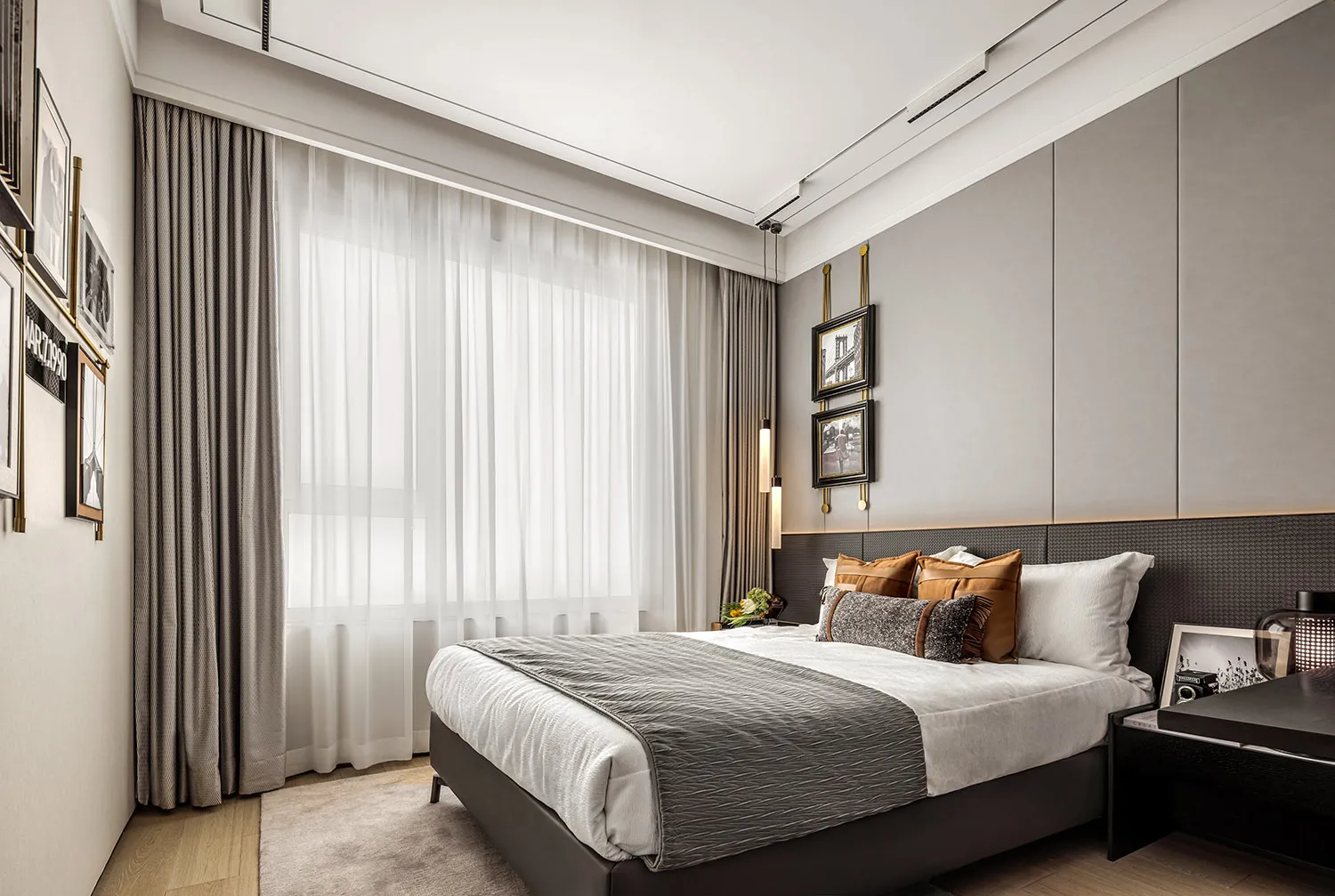 Modern bedroom featuring minimalist furniture and curtains.