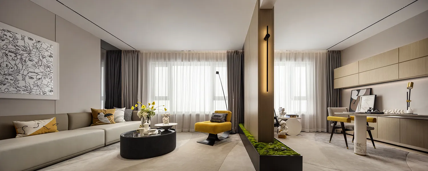 Modern minimalist living room with a neutral color palette, featuring a white sofa, yellow accent chair, and a black coffee t