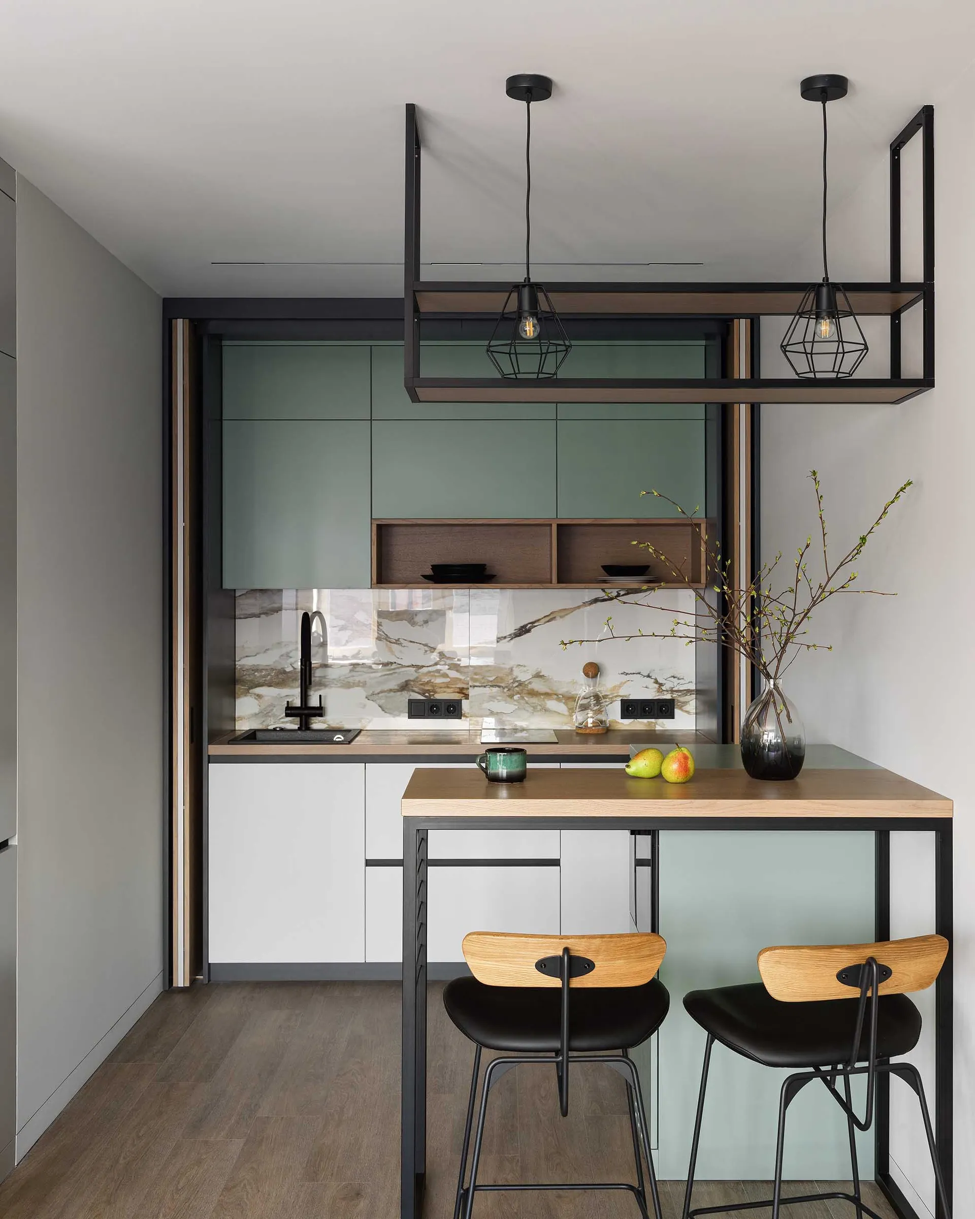 Modern mint green kitchen cabinets with a minimalist design