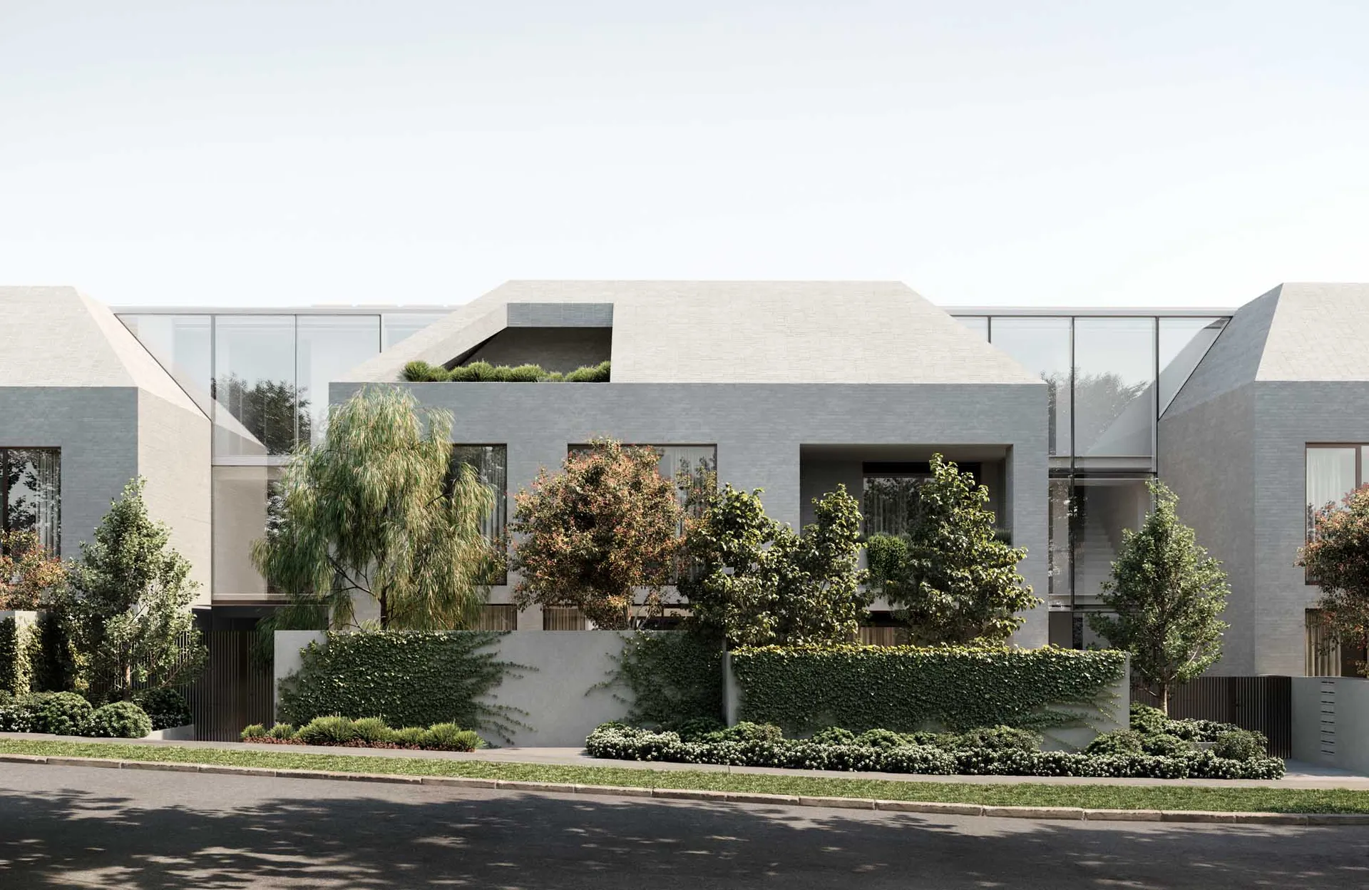 Modern residential building with a combination of concrete and glass materials.
