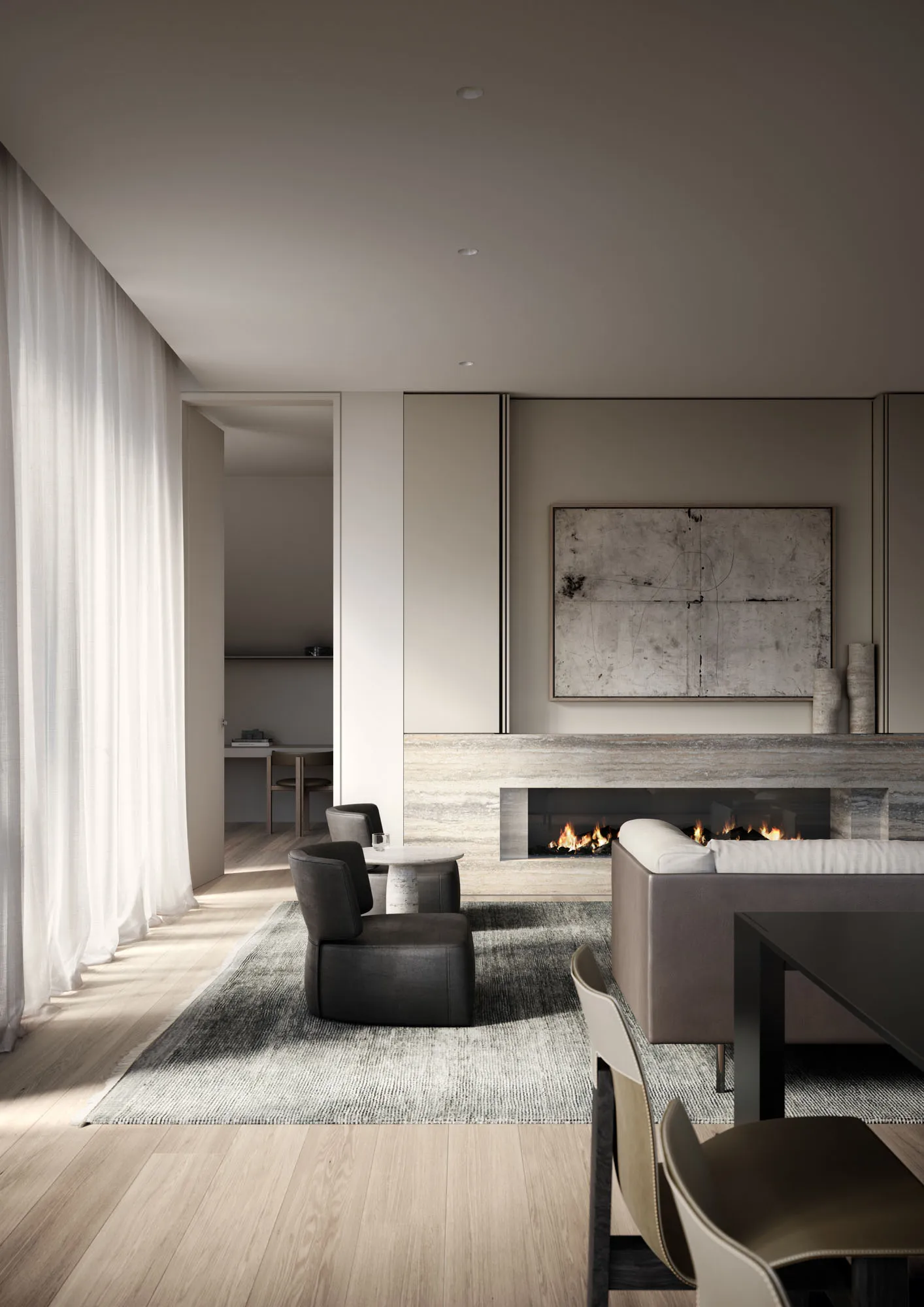 Modern living room featuring a concrete fireplace, leather furniture, and wood flooring.