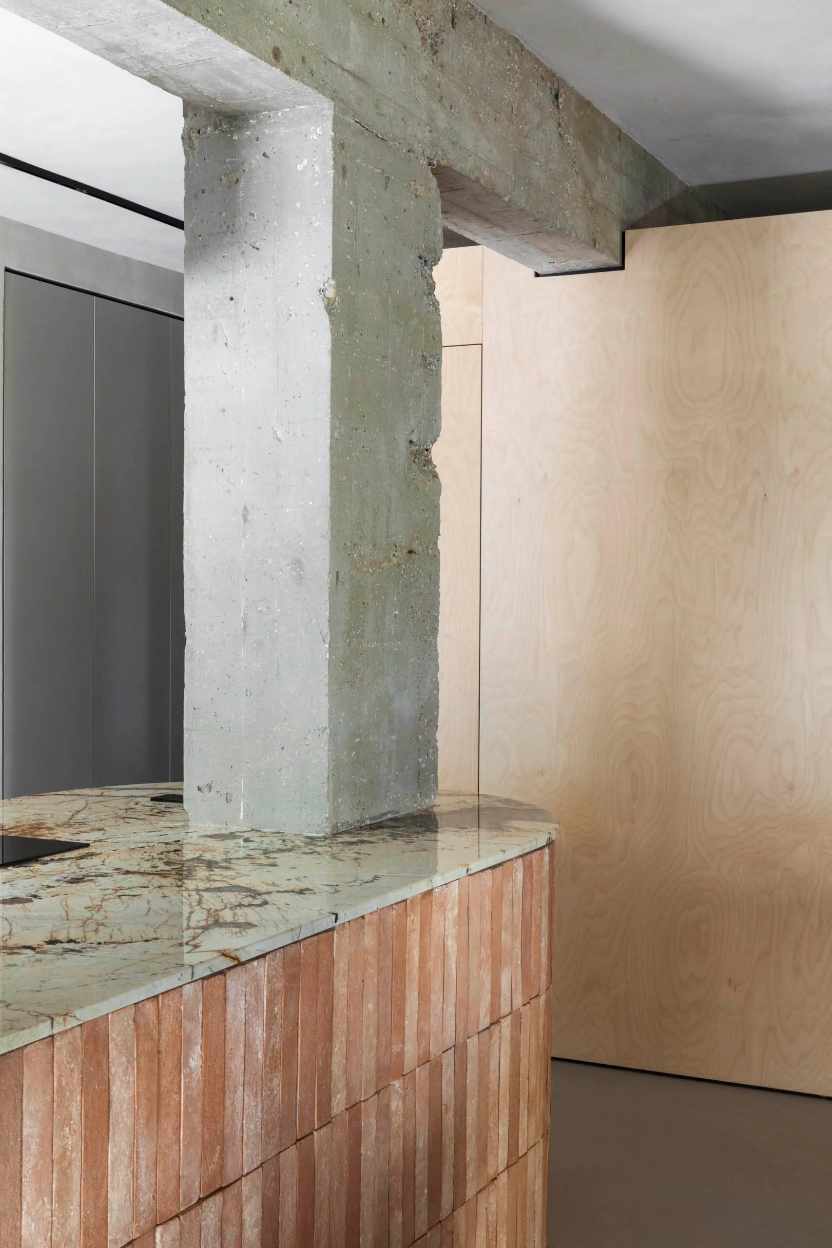 Modern interior with concrete and wooden elements.