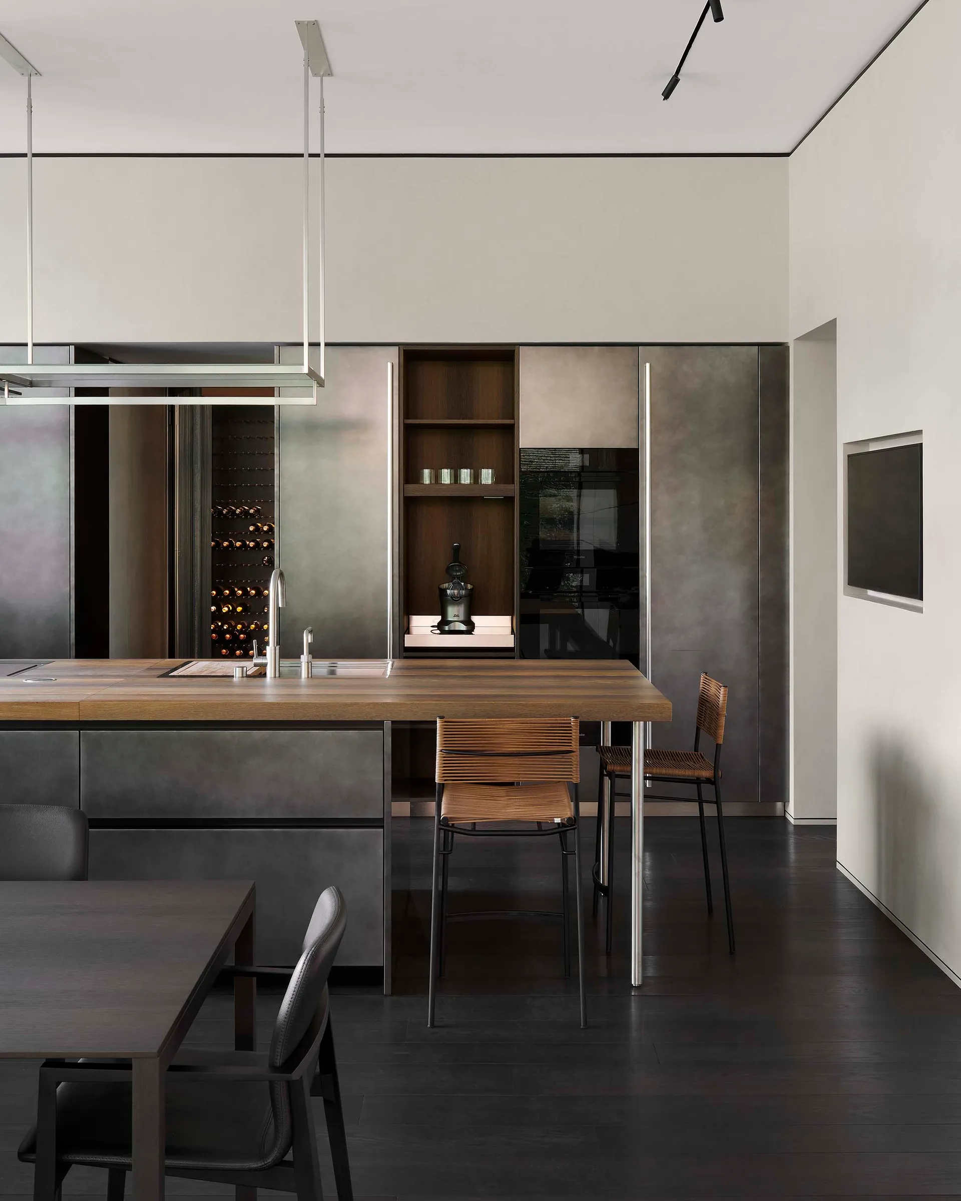 Modern residential kitchen featuring wooden countertops and metal cabinets.