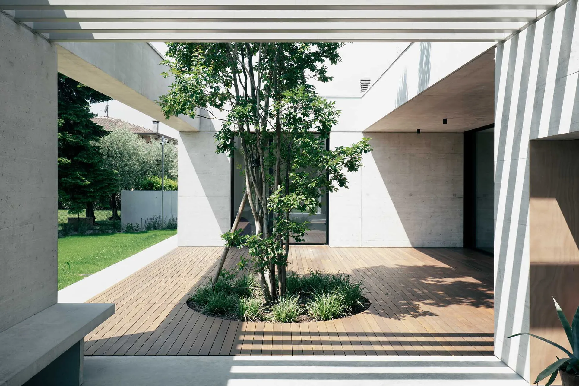 Concrete and wooden exterior of a modern residential building.