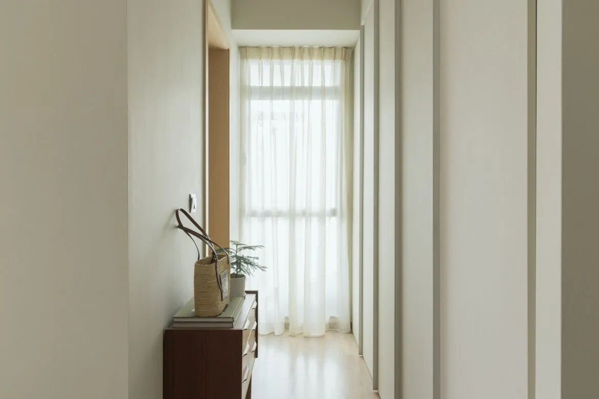 Modern hallway with white walls and wooden floor