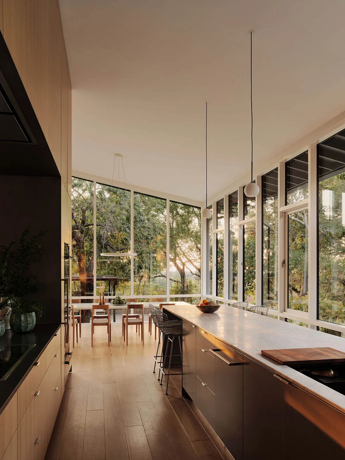 Modern kitchen with marble island and wooden cabinets
