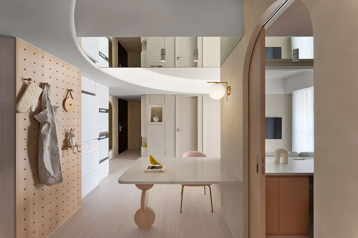 Modern minimalist kitchen and dining area featuring concrete and marble materials.