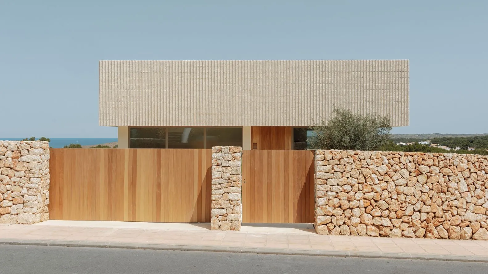 Modern residential building with stone and wood exterior