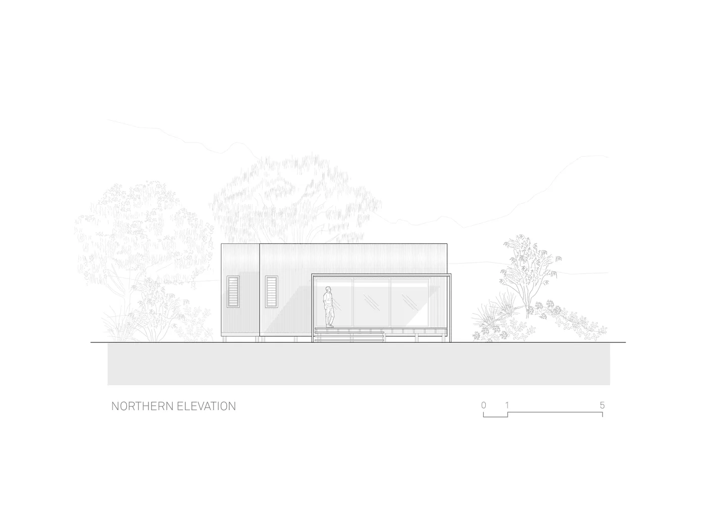 A modern sustainable house with metal cladding and glass features.