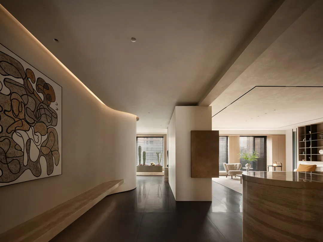 Modern living room featuring minimalist design with neutral tones and sleek finishes.