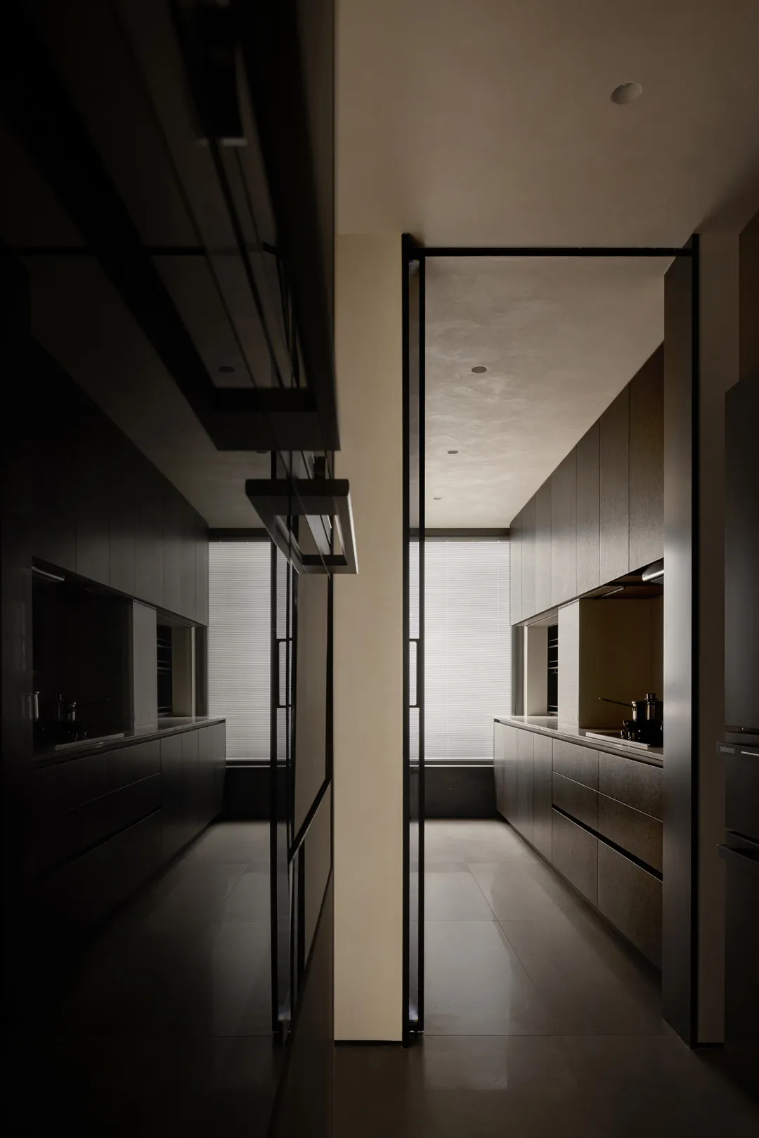 Modern dark grey kitchen with metallic texture and professional lighting
