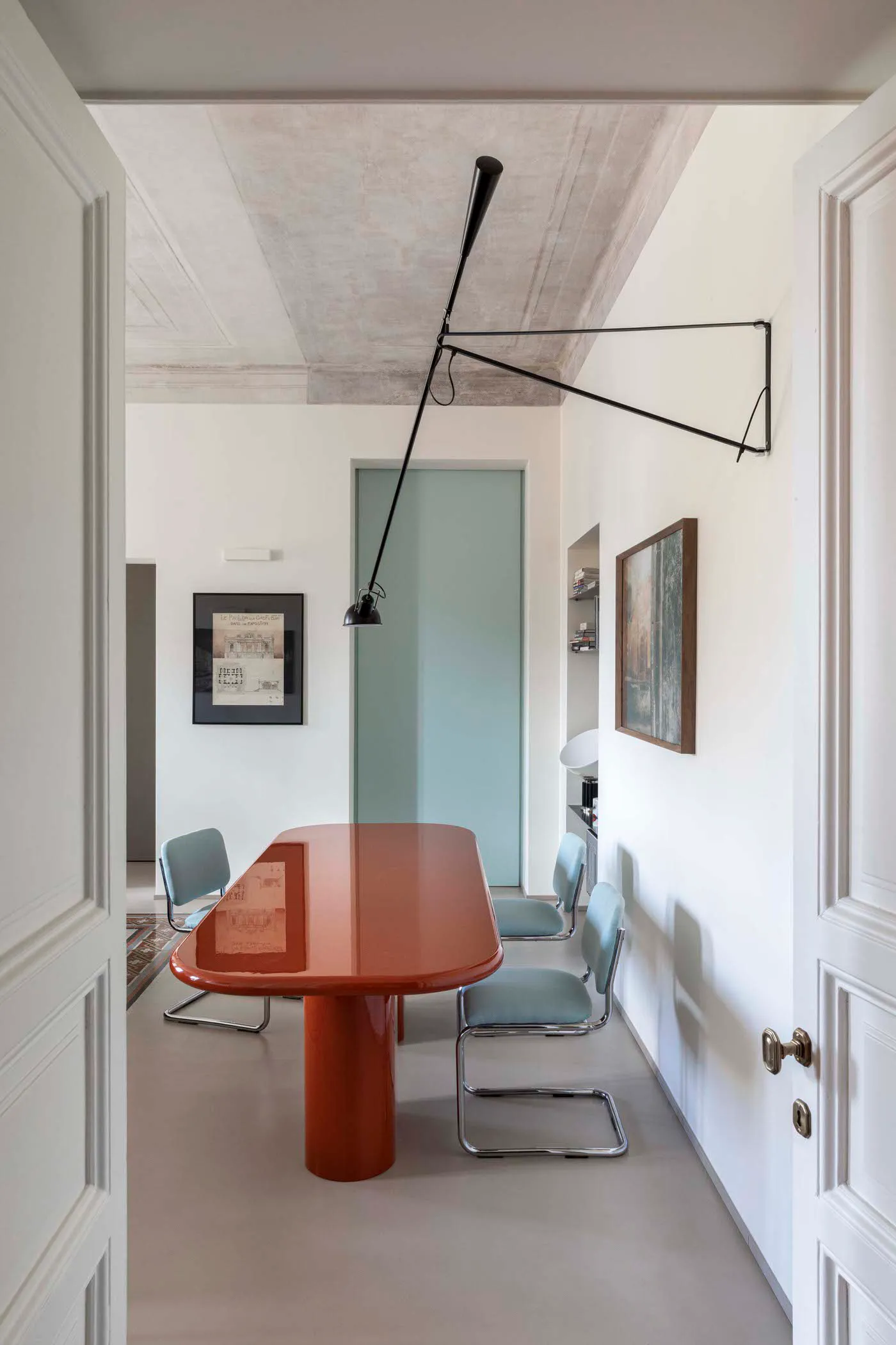 Minimalist dining room with modern furniture and sleek, contemporary design.