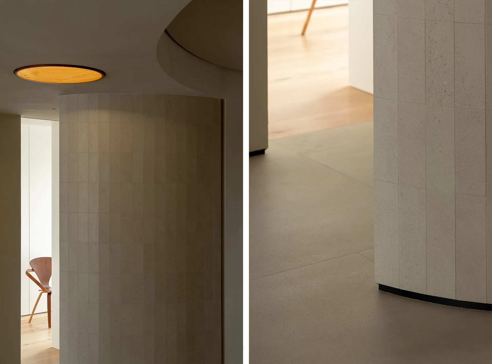 Modern residential interior with tile flooring and concrete elements.