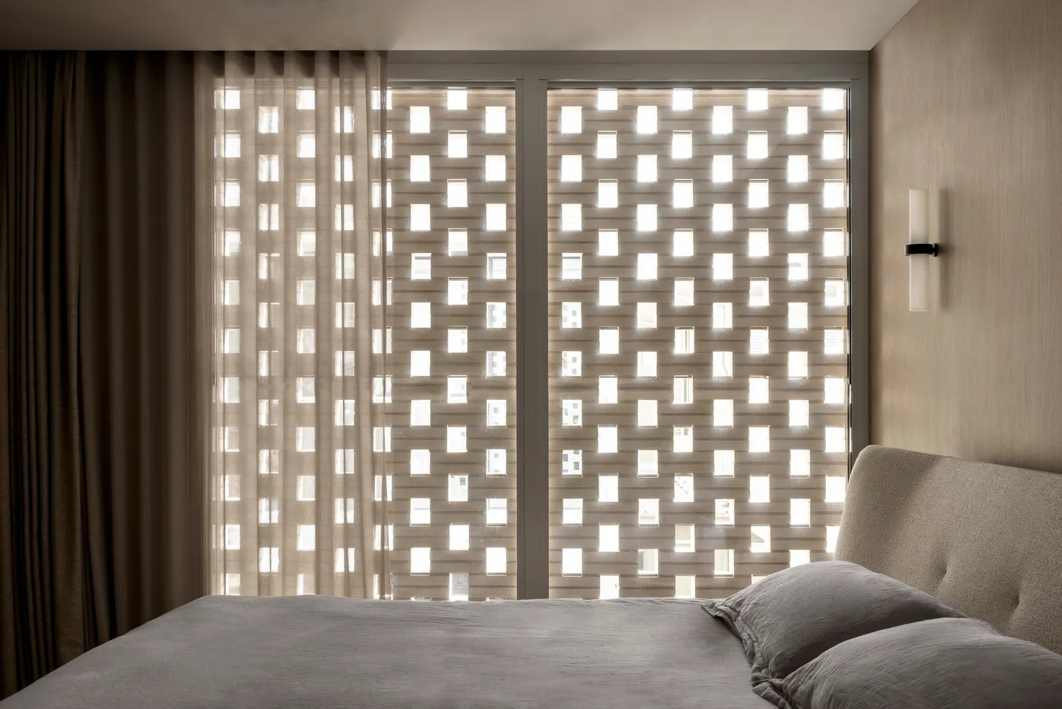 Minimalist bedroom featuring a glass partition wall