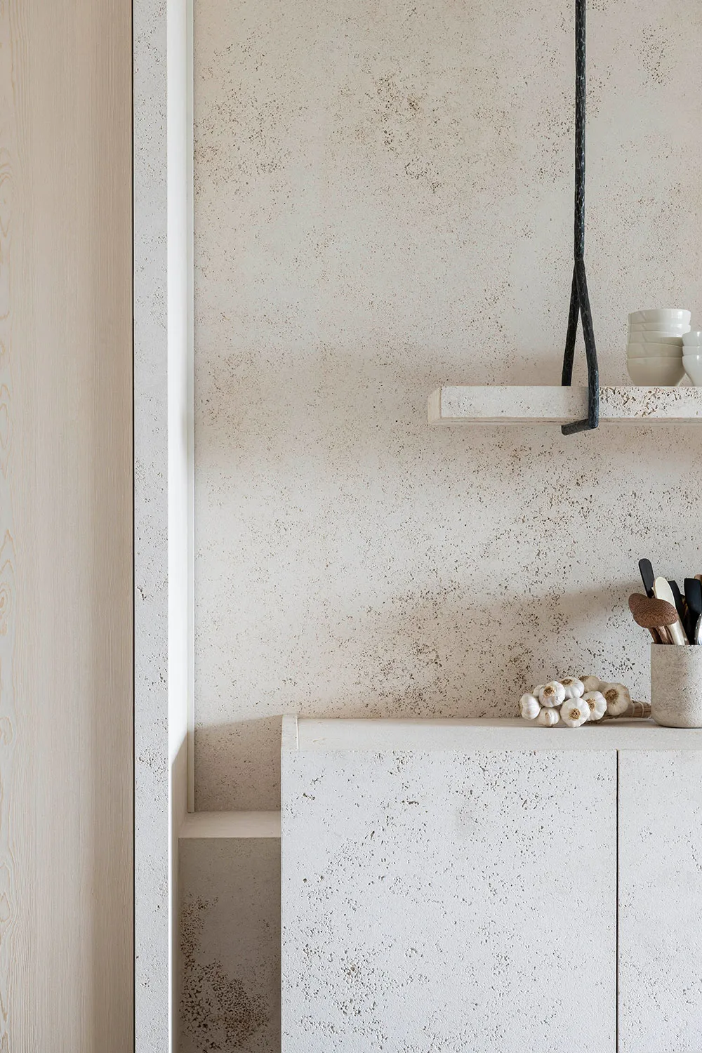 Concrete kitchen counter with minimalist design elements.