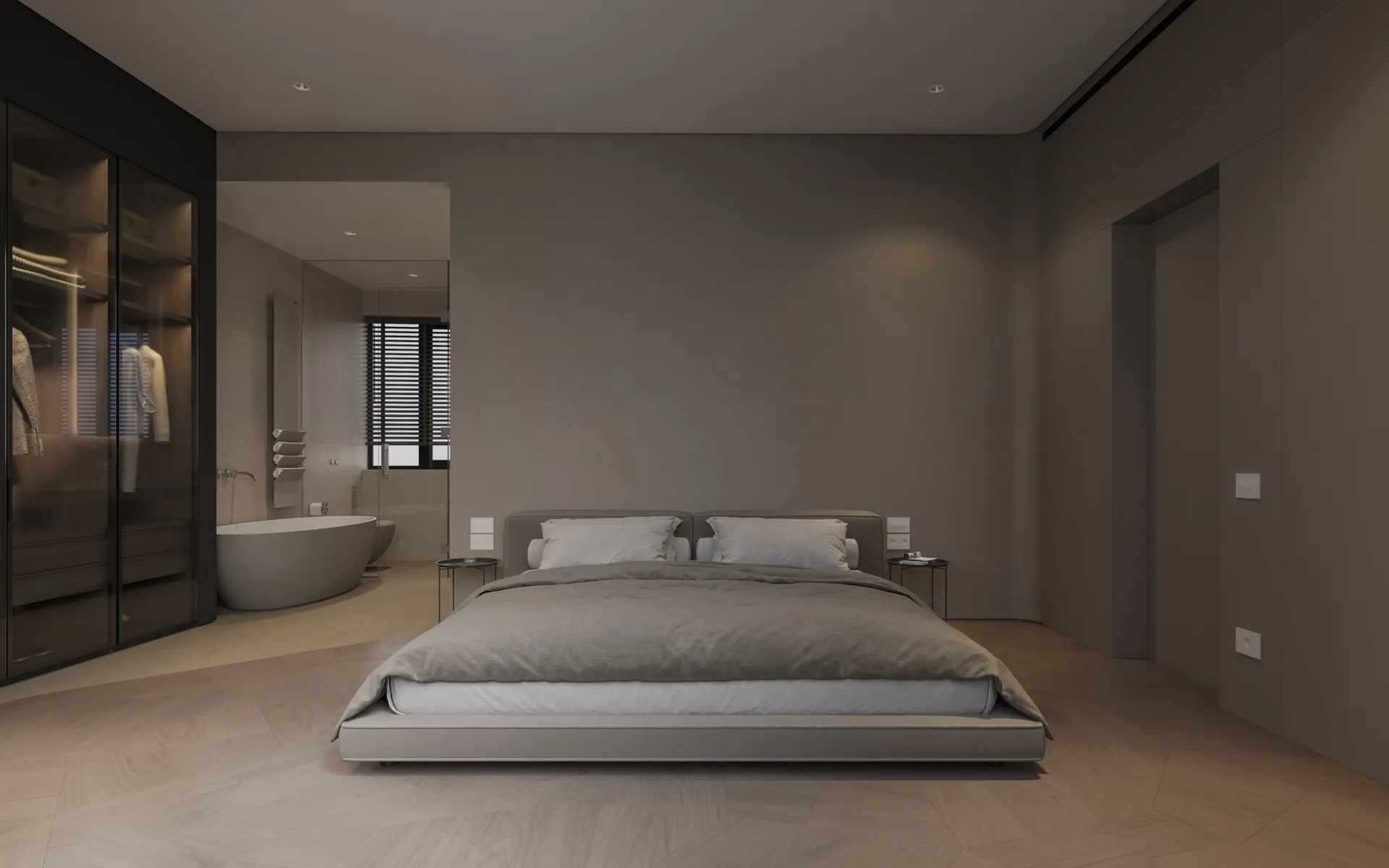 A modern, minimalist bedroom with dark interior design featuring a platform bed, wooden floors, and a glass-walled bathroom w