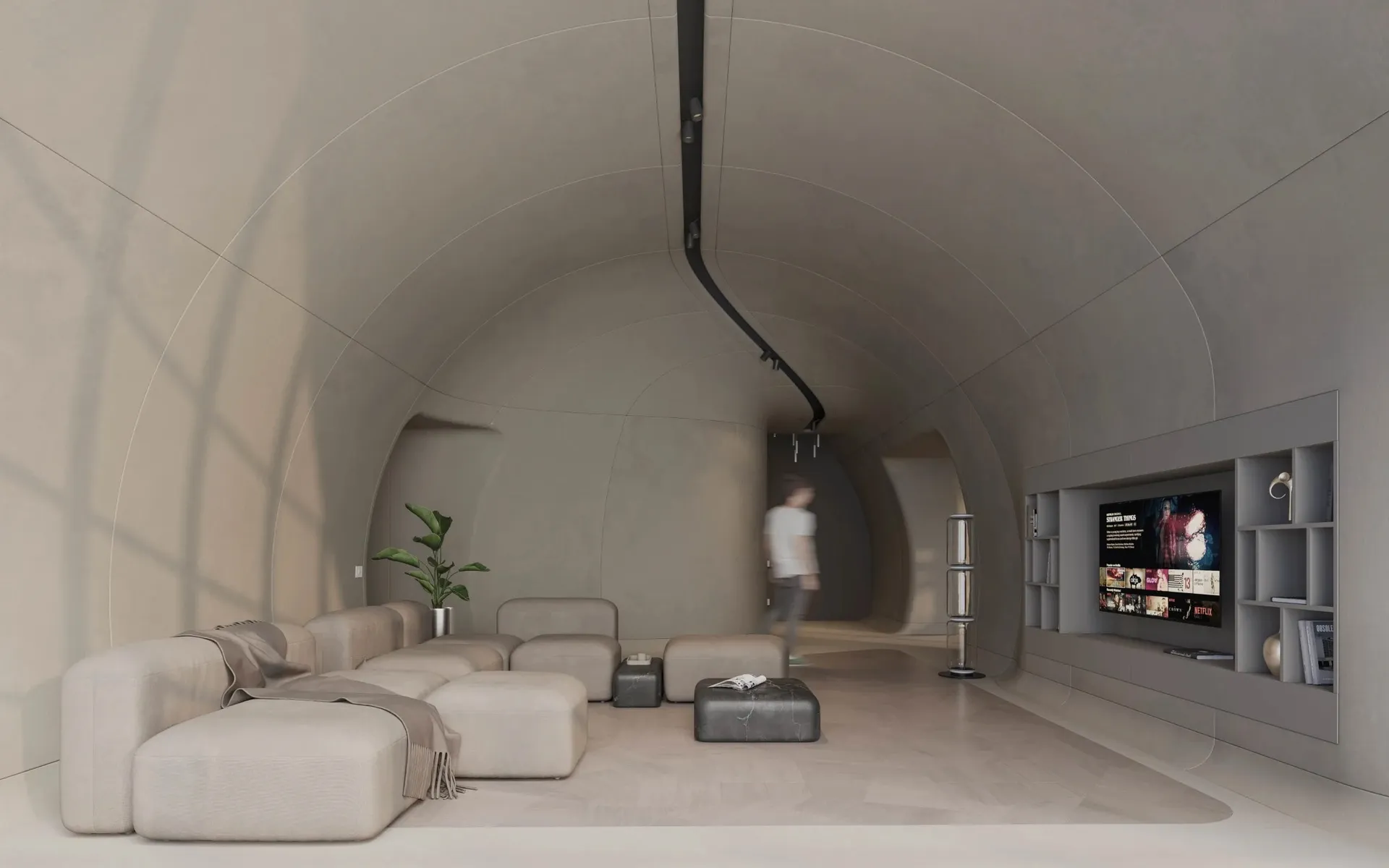 Modern living room with minimalist design, concrete walls, and leather furniture.