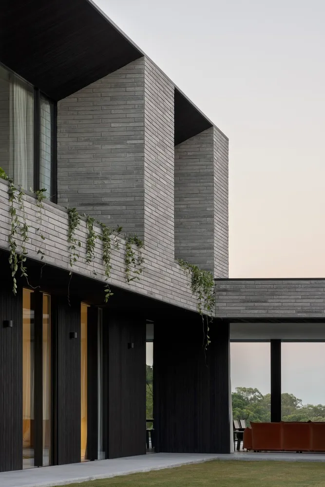 Modern residential exterior featuring brick-clay material.