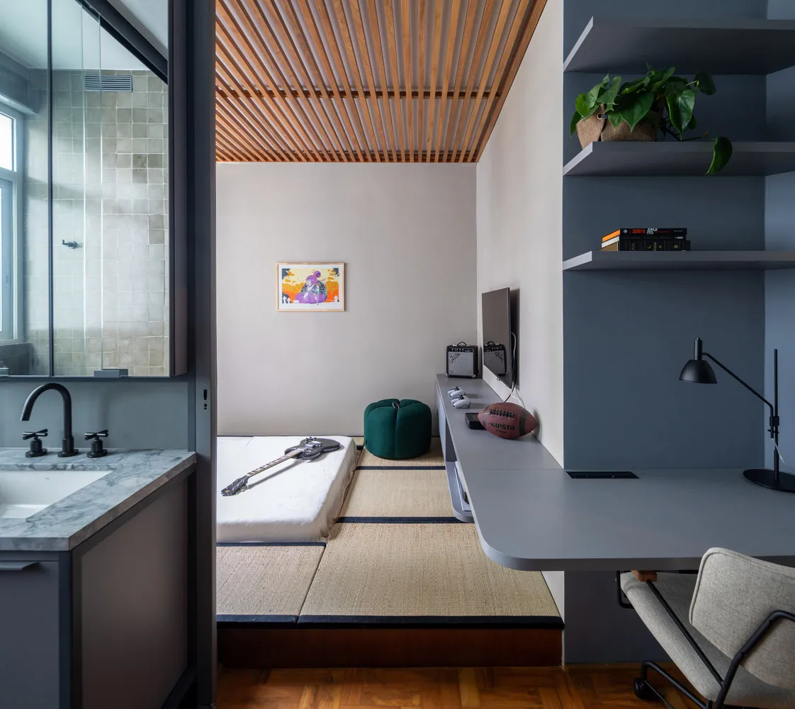 A minimalist bedroom featuring wood paneling, glass windows, and a tatami floor.