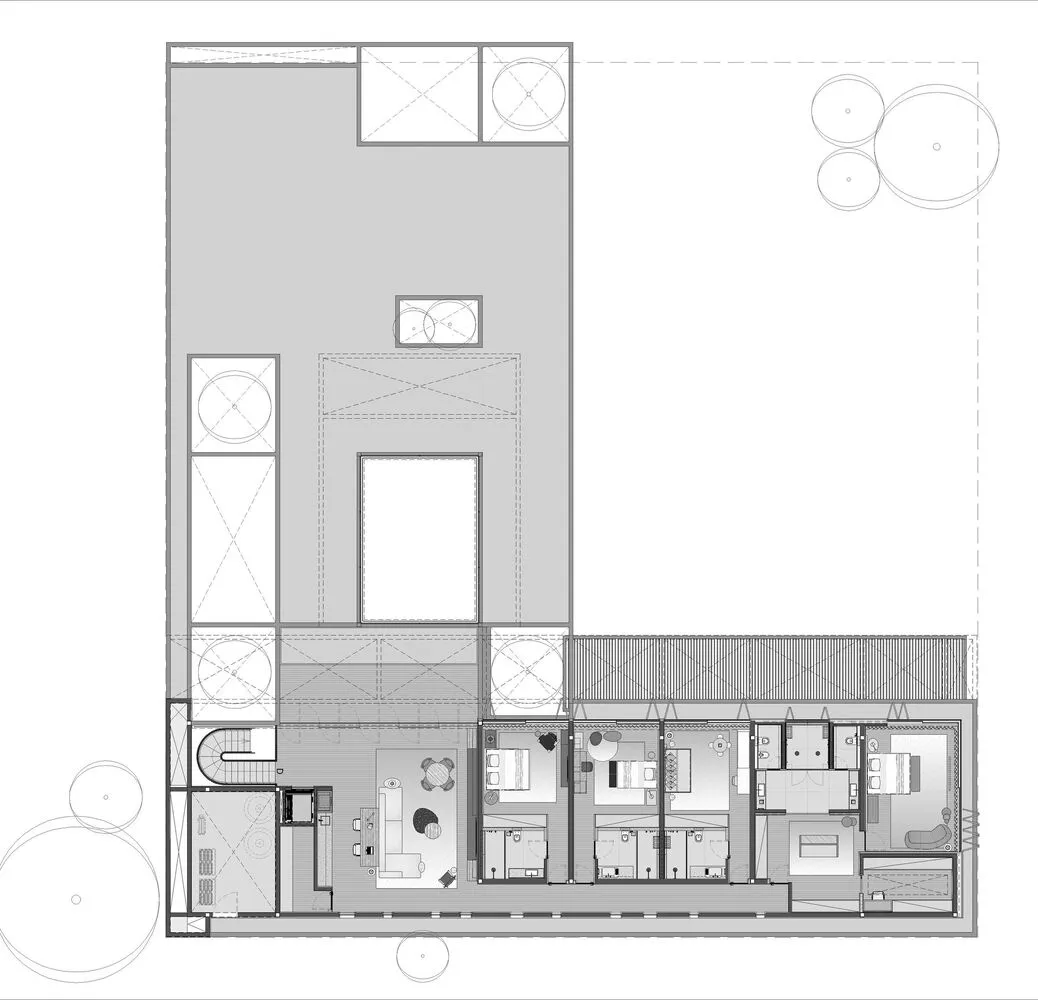 A black and white architectural drawing of a modern residential floor plan on paper