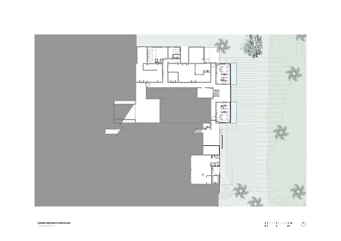 Floor plan detailing the layout of a residential building's ground level, including rooms and spaces.