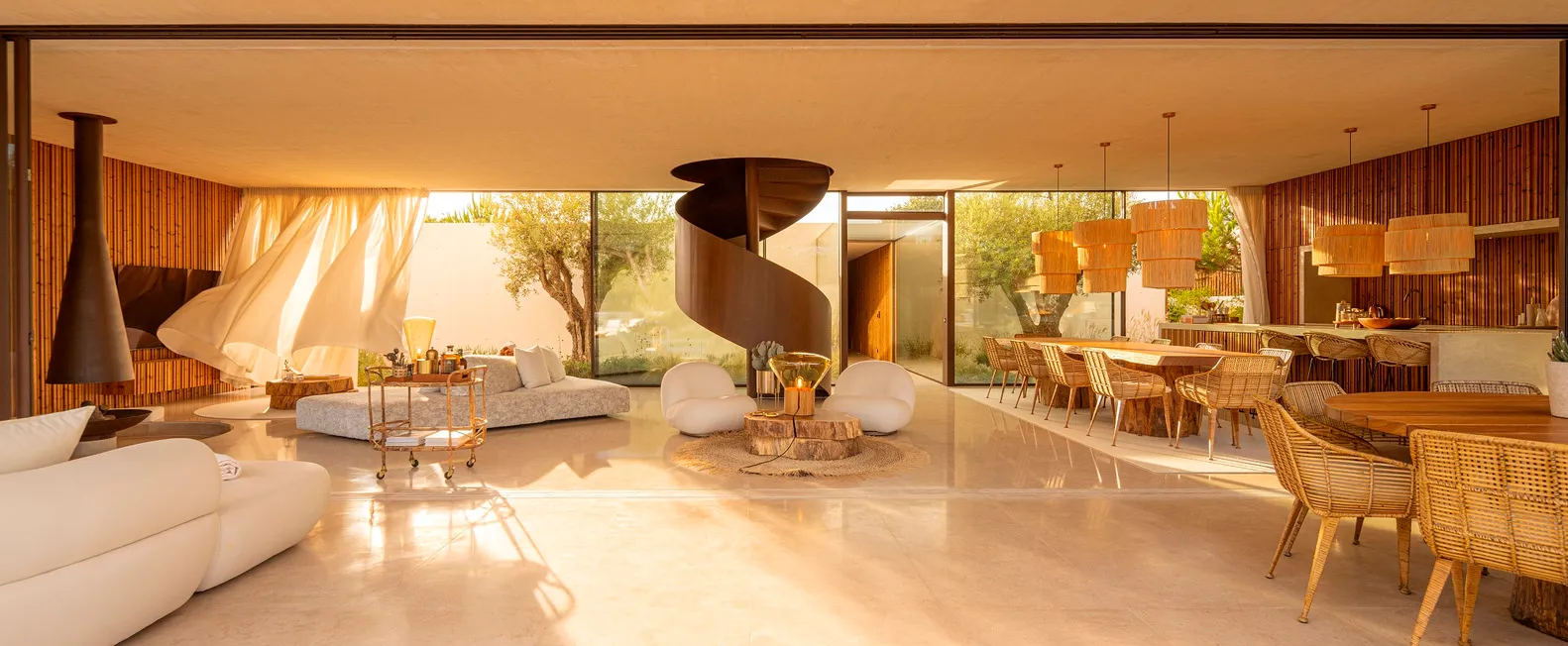Modern living room with spiral staircase and wooden furnishings.