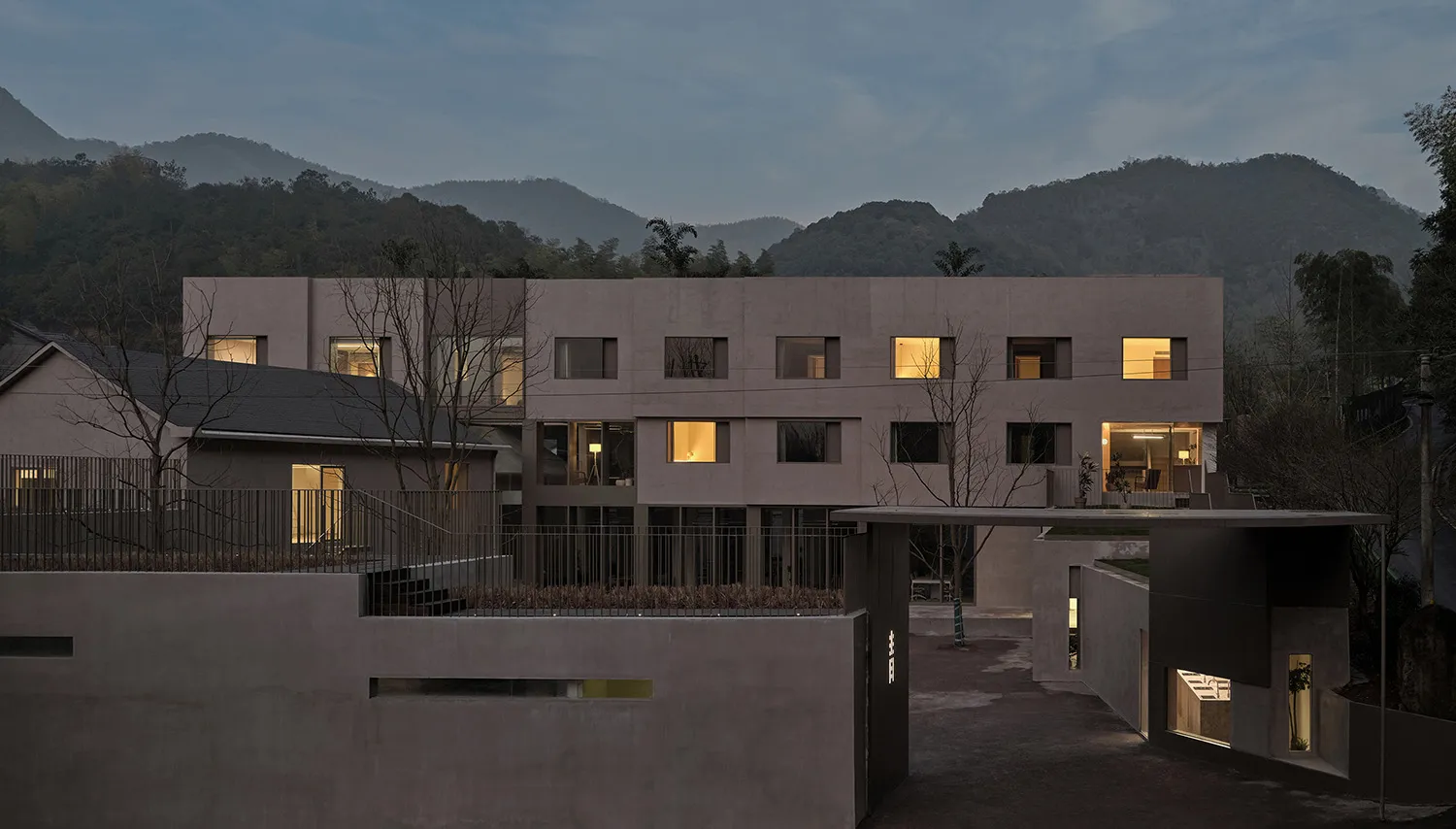 A minimalist, modern residential building constructed with concrete.