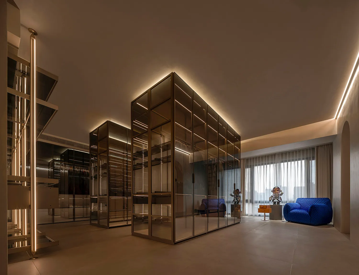 Modern interior design featuring glass, metal, and fabric elements.