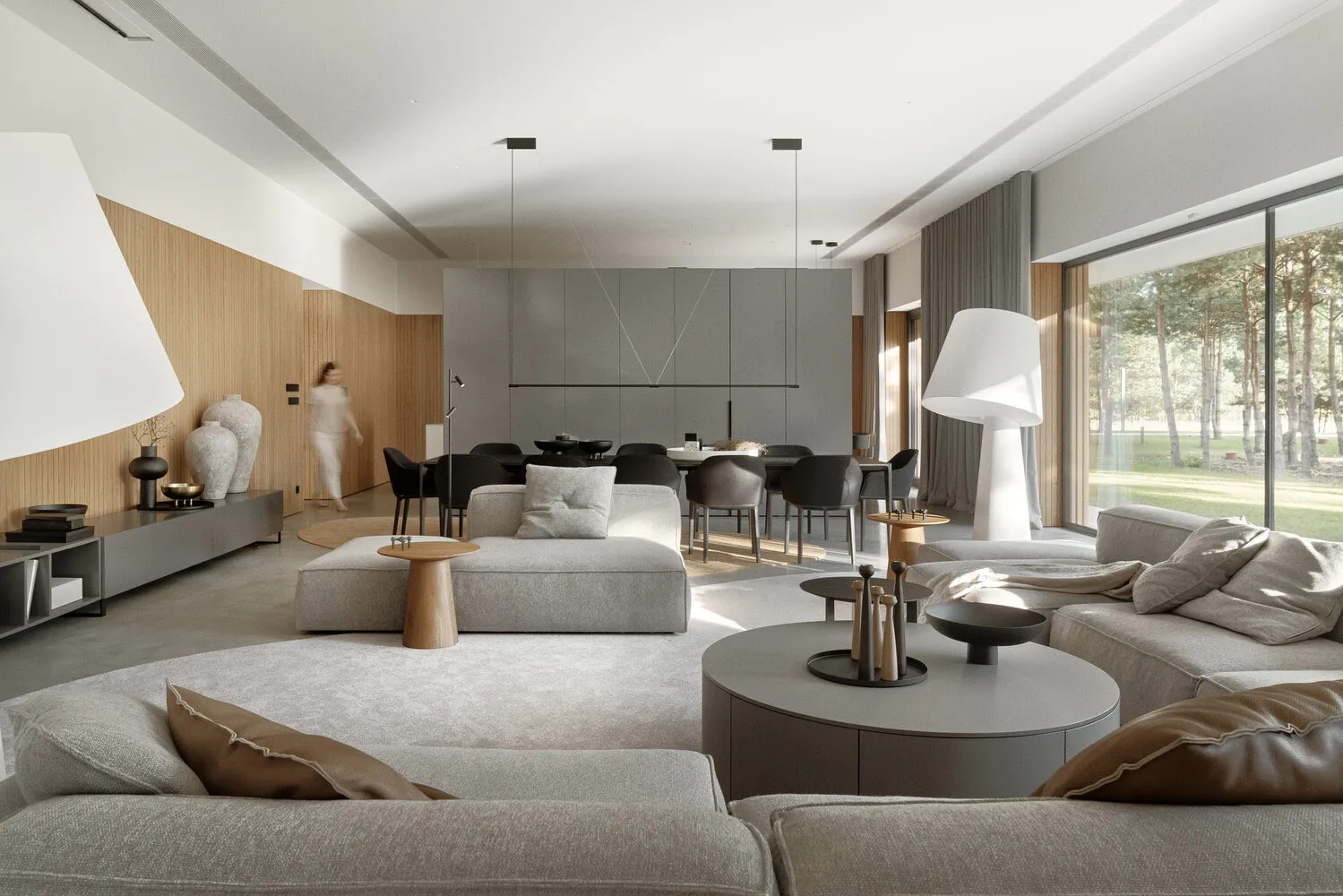 Minimalist living room with modern furniture and open layout.