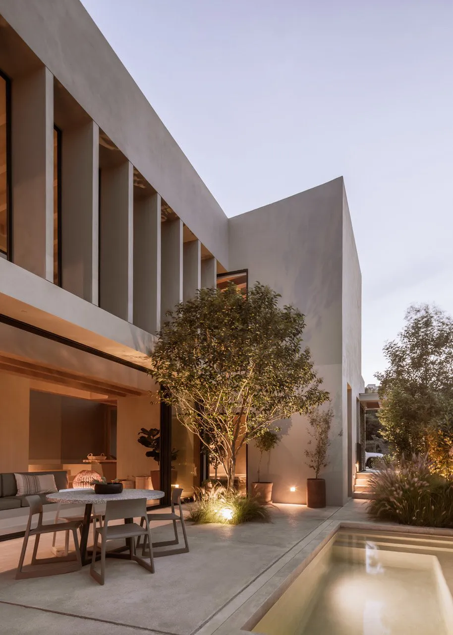Modern residential exterior with concrete materials and minimalistic design features.