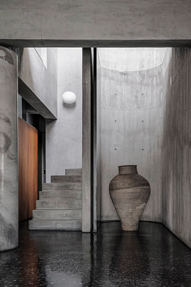 Modern home interior featuring polished concrete floors and minimalist design elements.