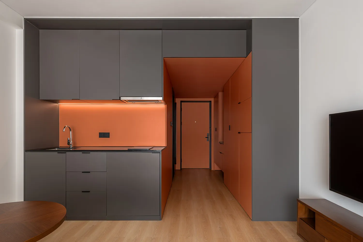 Well-designed modern kitchen with metallic accents in an apartment