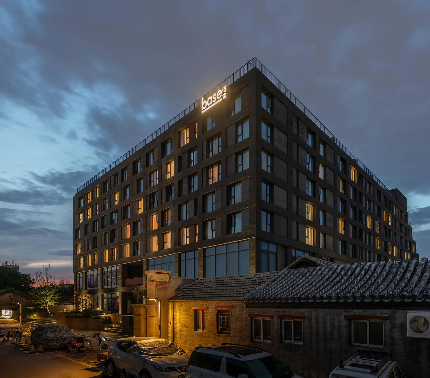 A modern commercial building with a brick and concrete exterior.