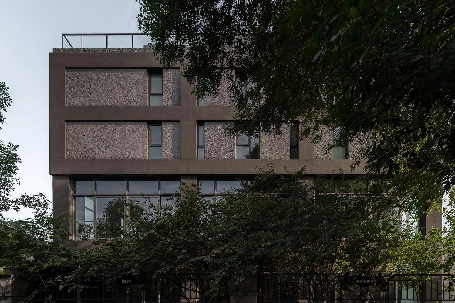 Modern building exterior with concrete facade and large windows