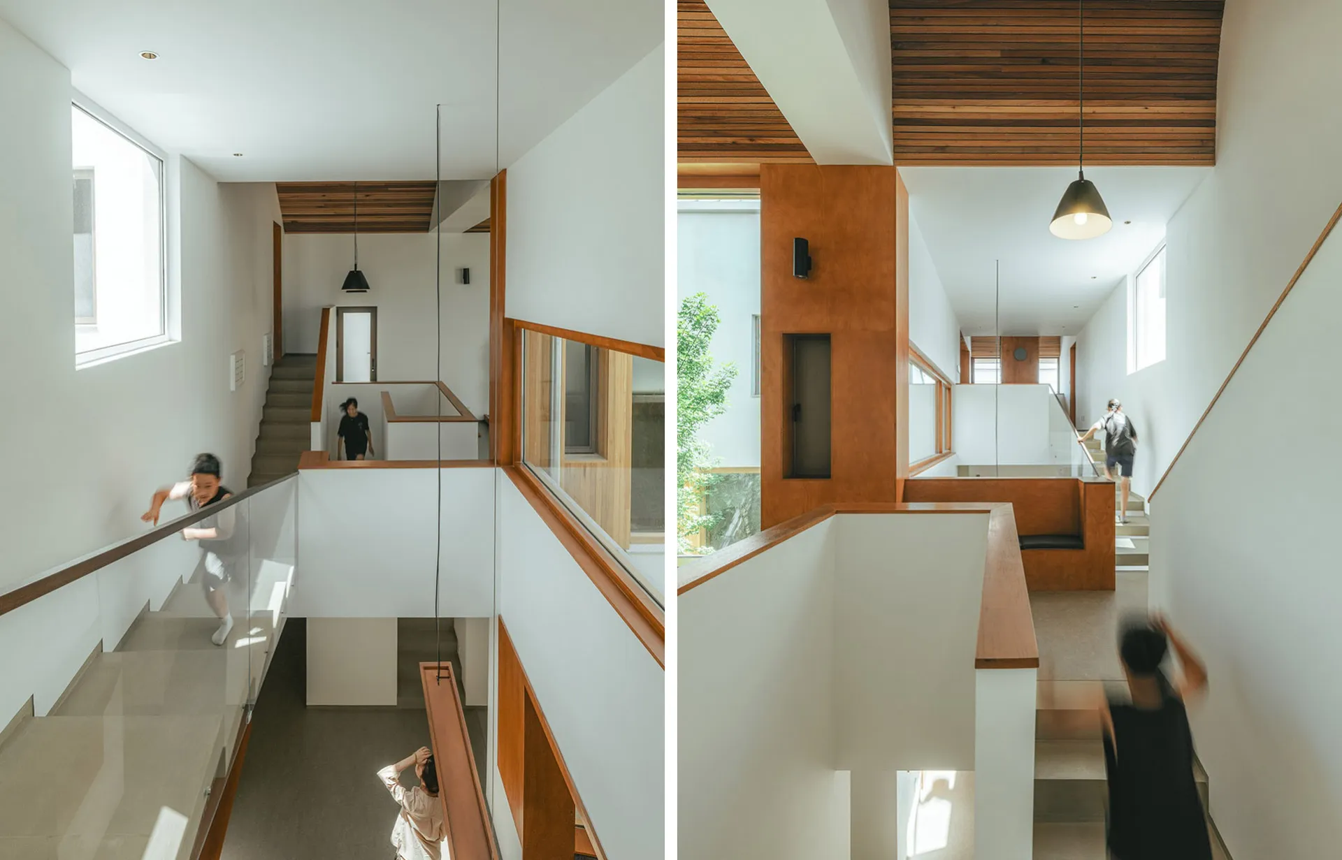 A modern interior space featuring a white concrete staircase with wooden accents.