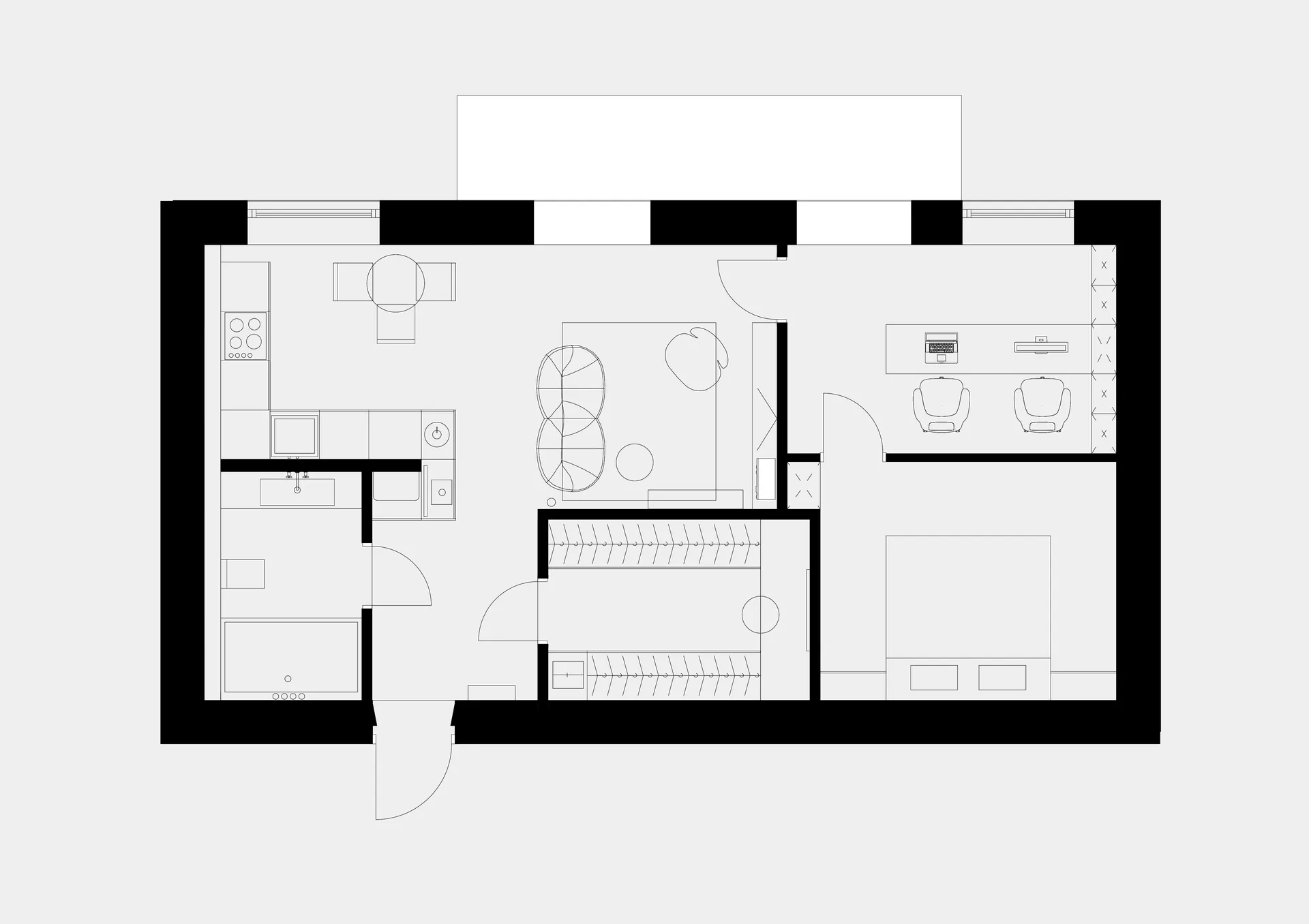 A minimalist residential floor plan that features a living room, kitchen, bedroom, and bathroom.