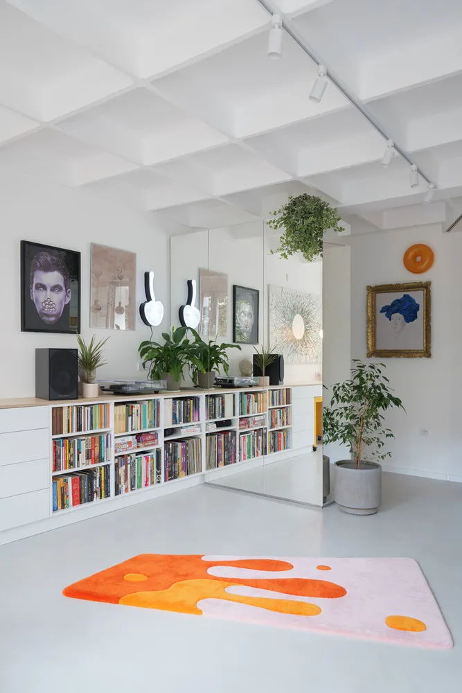 A minimalist living room featuring neutral tones and modern decor.