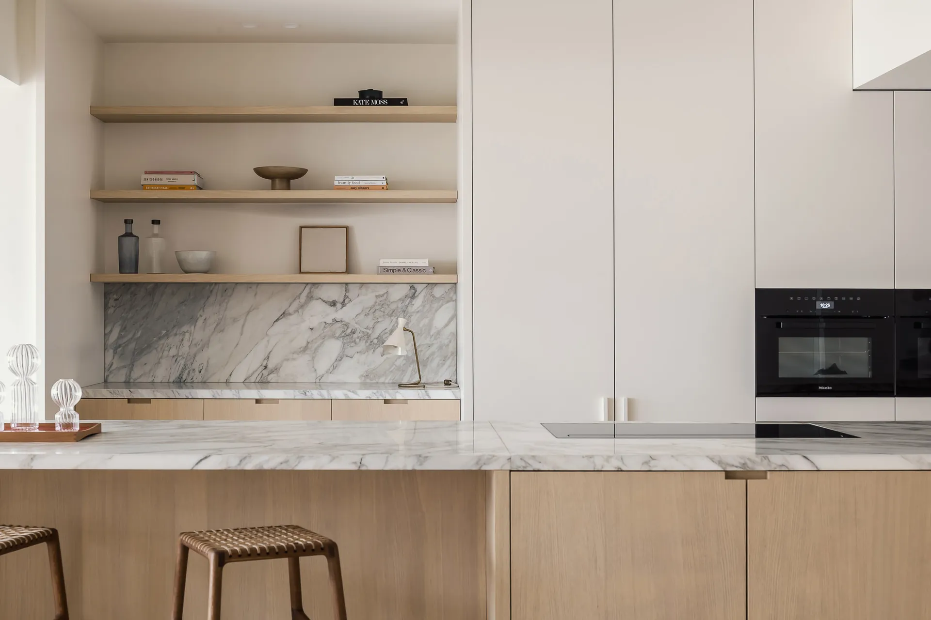 Modern kitchen featuring marble countertop and minimalist design