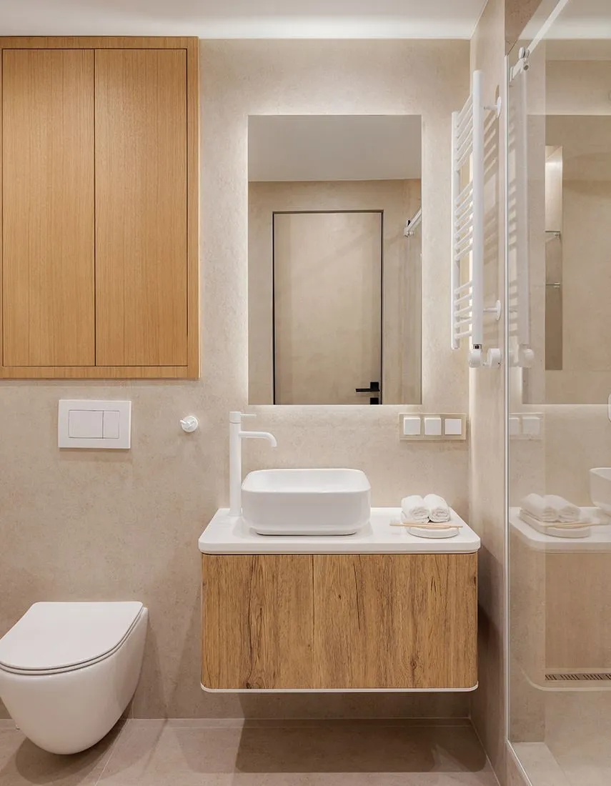 Modern minimalist bathroom featuring ceramic tiles and wooden vanity