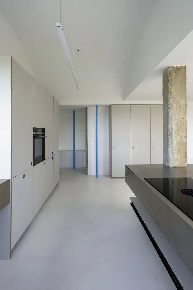 Modern kitchen featuring concrete flooring and minimalist design