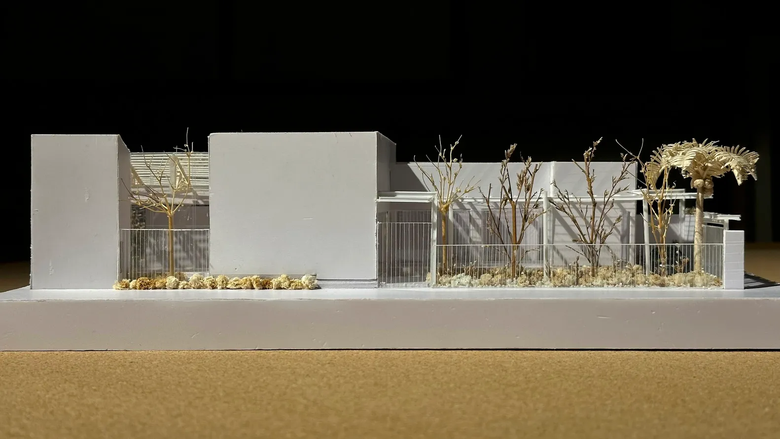 Modern white architectural model with minimalist design and white materials.