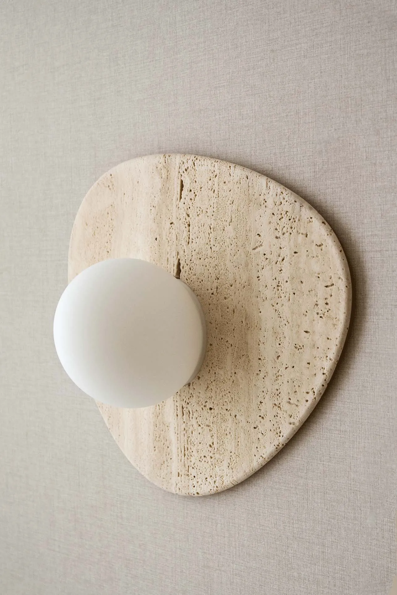 A modern industrial stone lighting fixture.