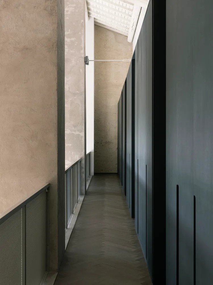 A minimalist interior design featuring a concrete cabinet and wooden shelves.