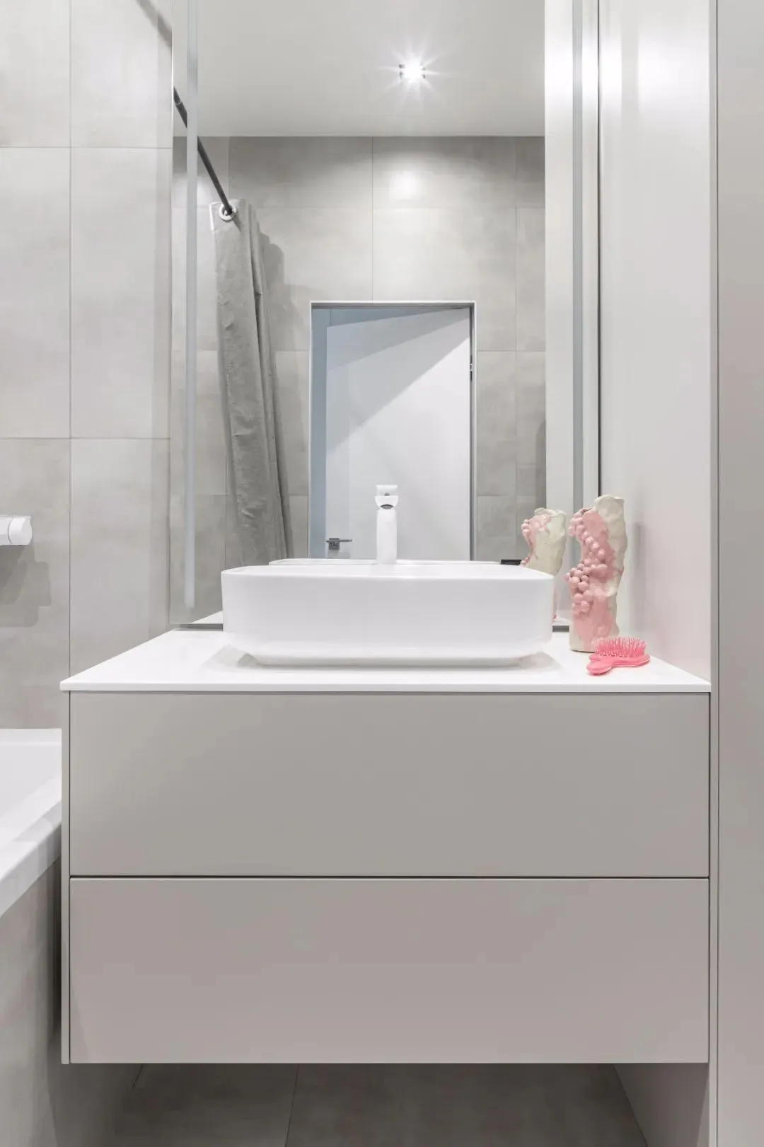 Modern bathroom with concrete sink and countertop, minimalistic design.