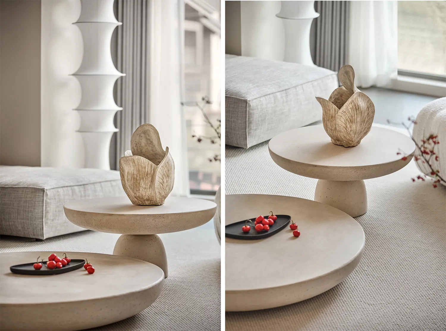 Modern minimalist concrete and ceramic living room furniture with a geometric vase centerpiece.