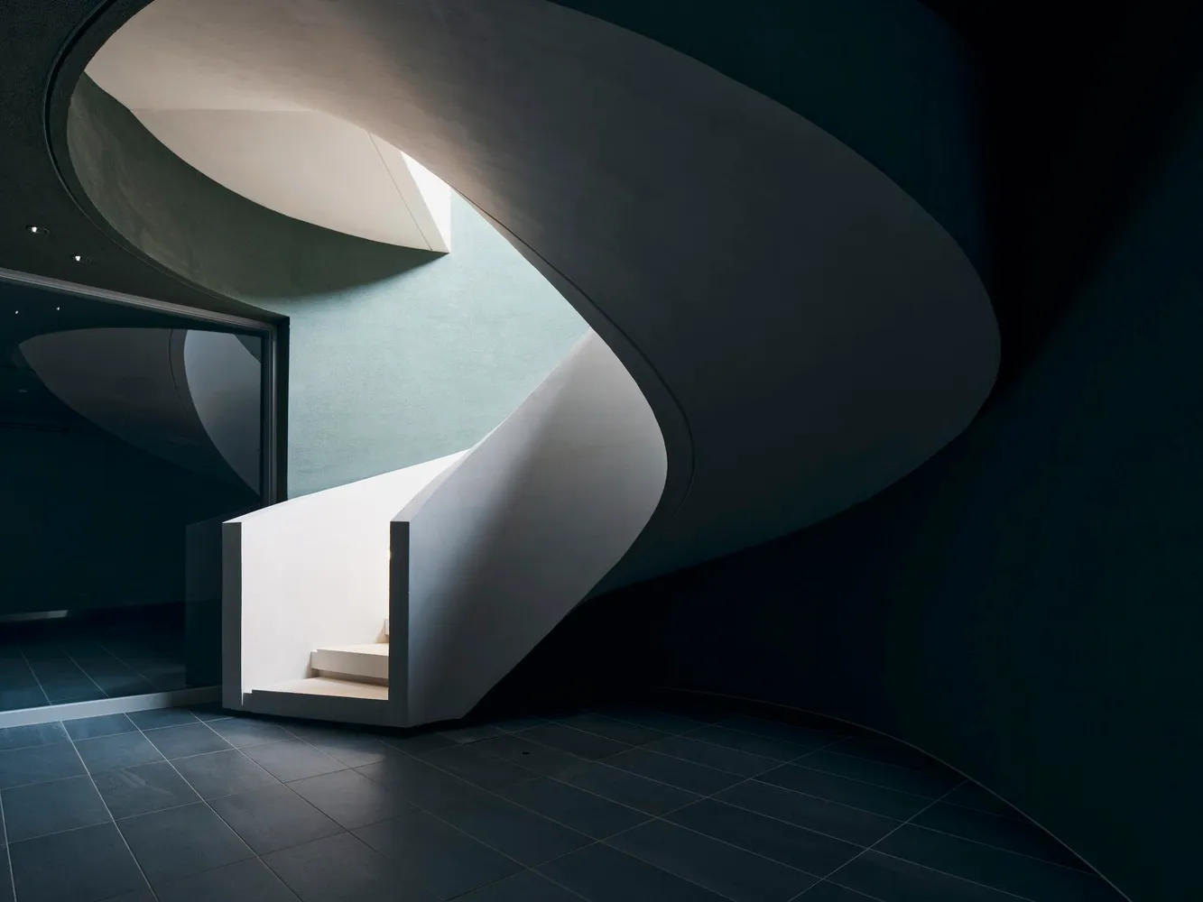 Modern staircase made of white concrete materials.