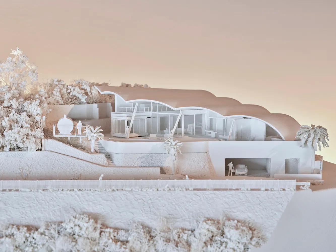 A modern residential architectural model in a white on white color scheme, showcasing clean lines and open space.