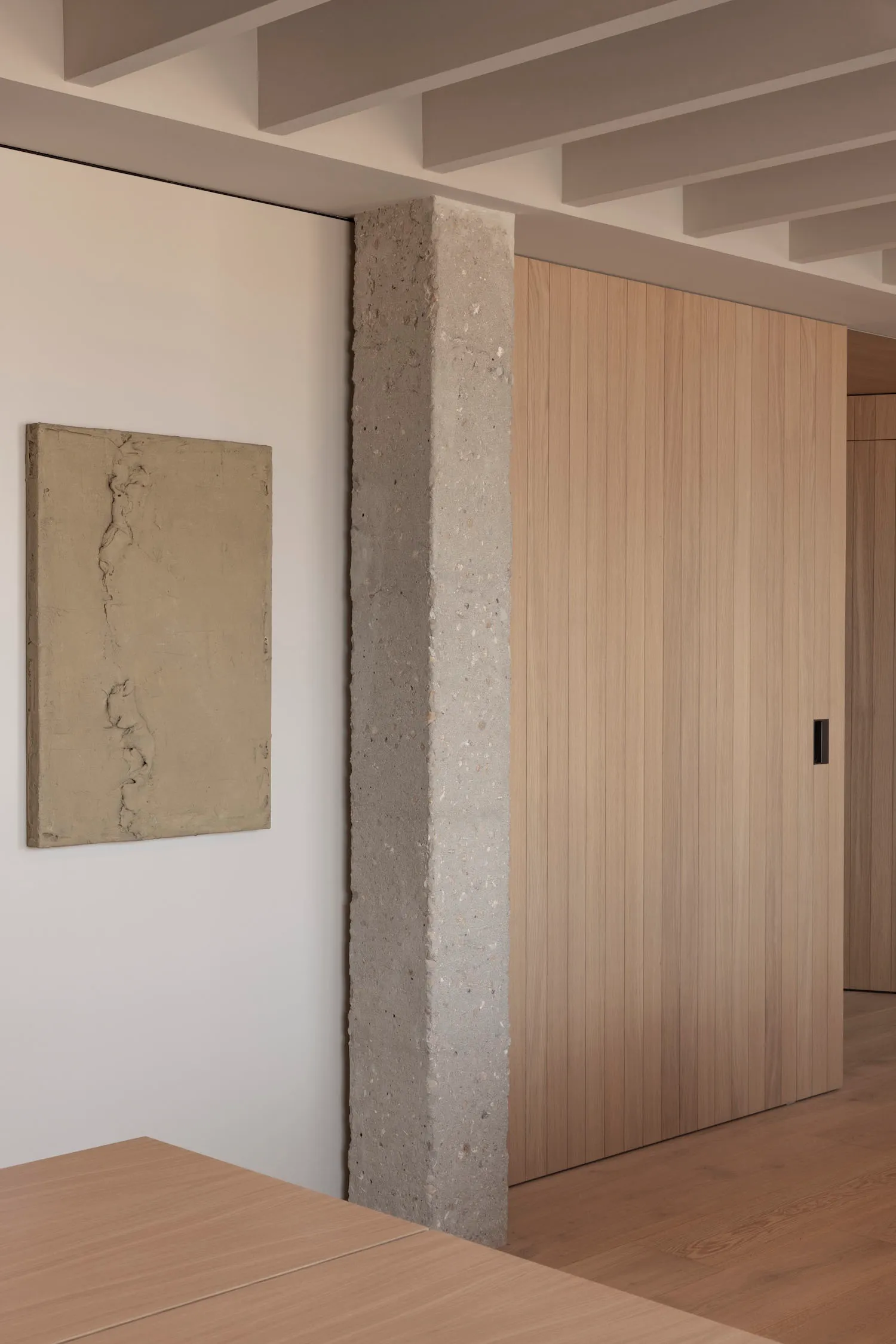 Modern minimalist interior design with concrete pillar and wooden paneling